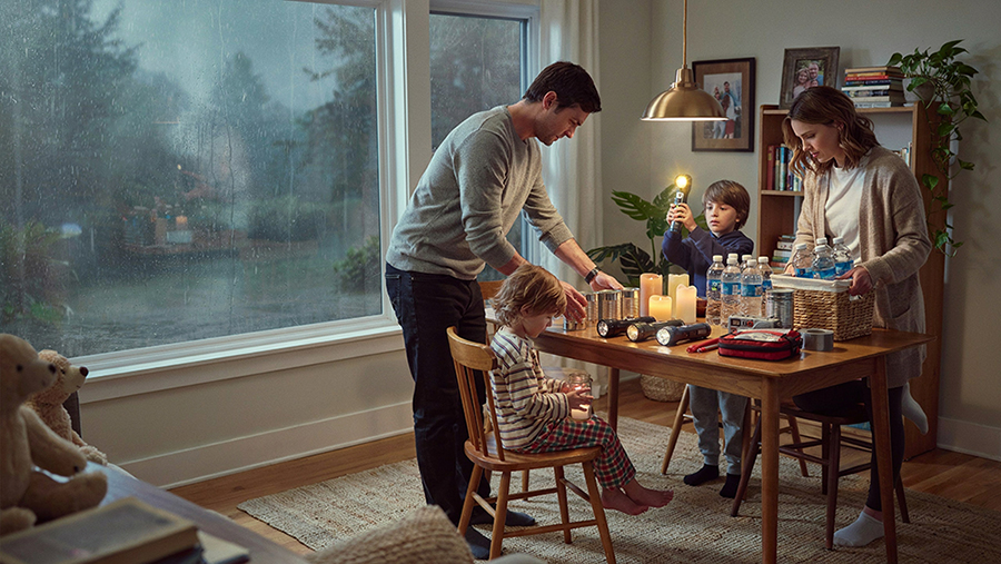 Family getting supplies together in preparation for a hurricane