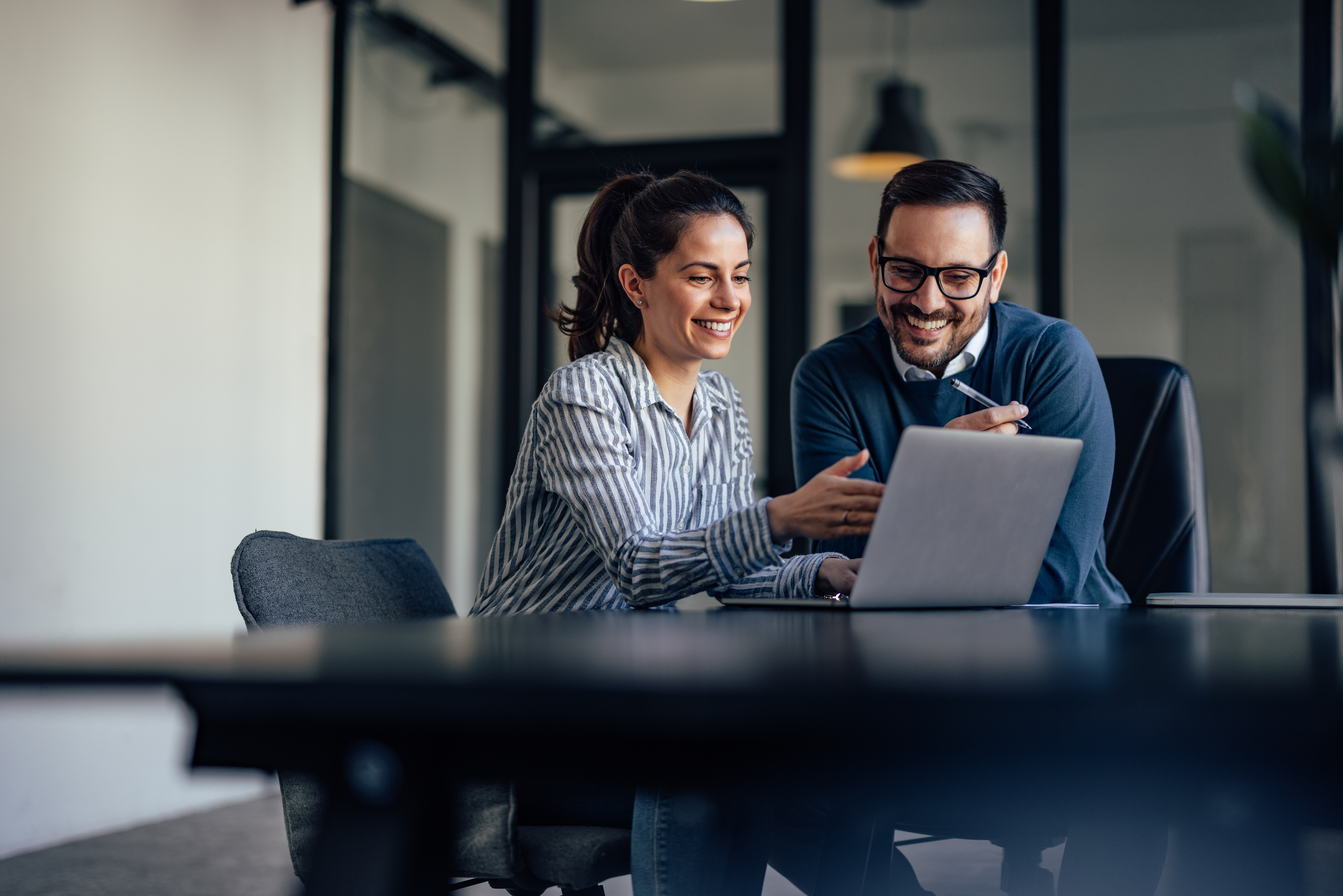 Couple reviewing insurance coverage smiling